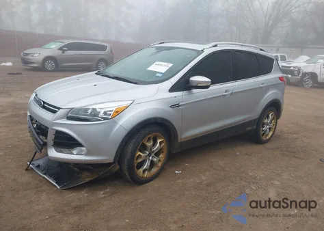 2014 Ford Escape Titanium z USA, uszkodzony, nr VIN 1FMCU0J9XEUD24499